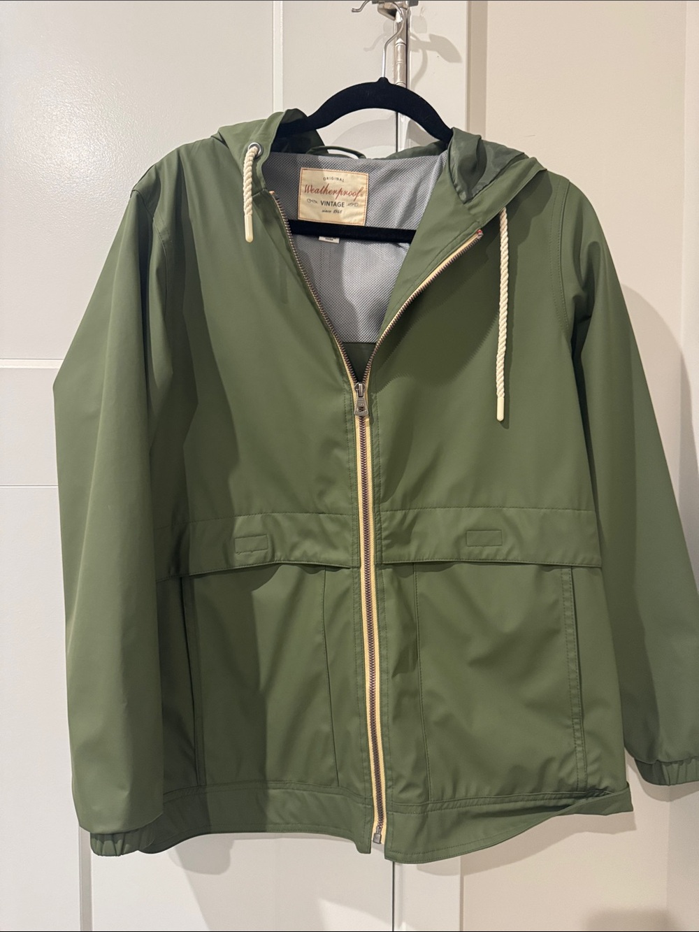 Green women’s raincoat